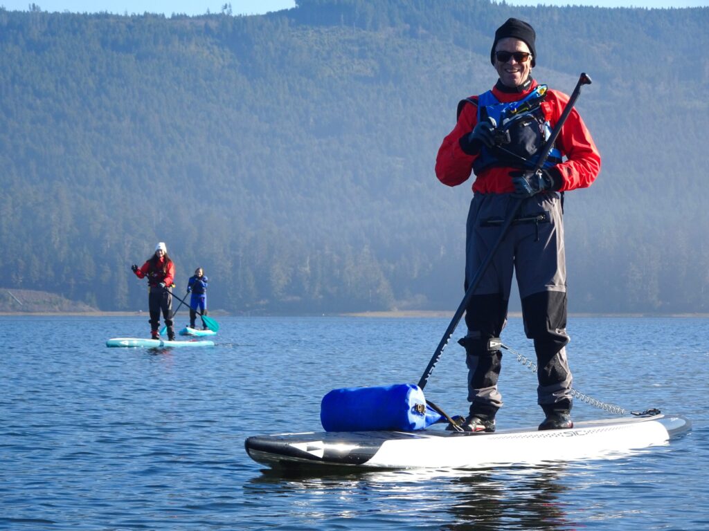 Man standing on paddle board